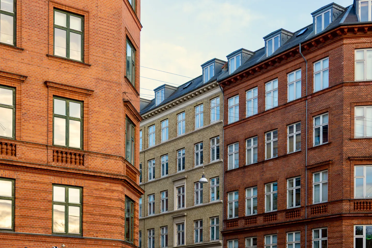 Traditional Copenhagen apartment buildings in warm red and yellow brick