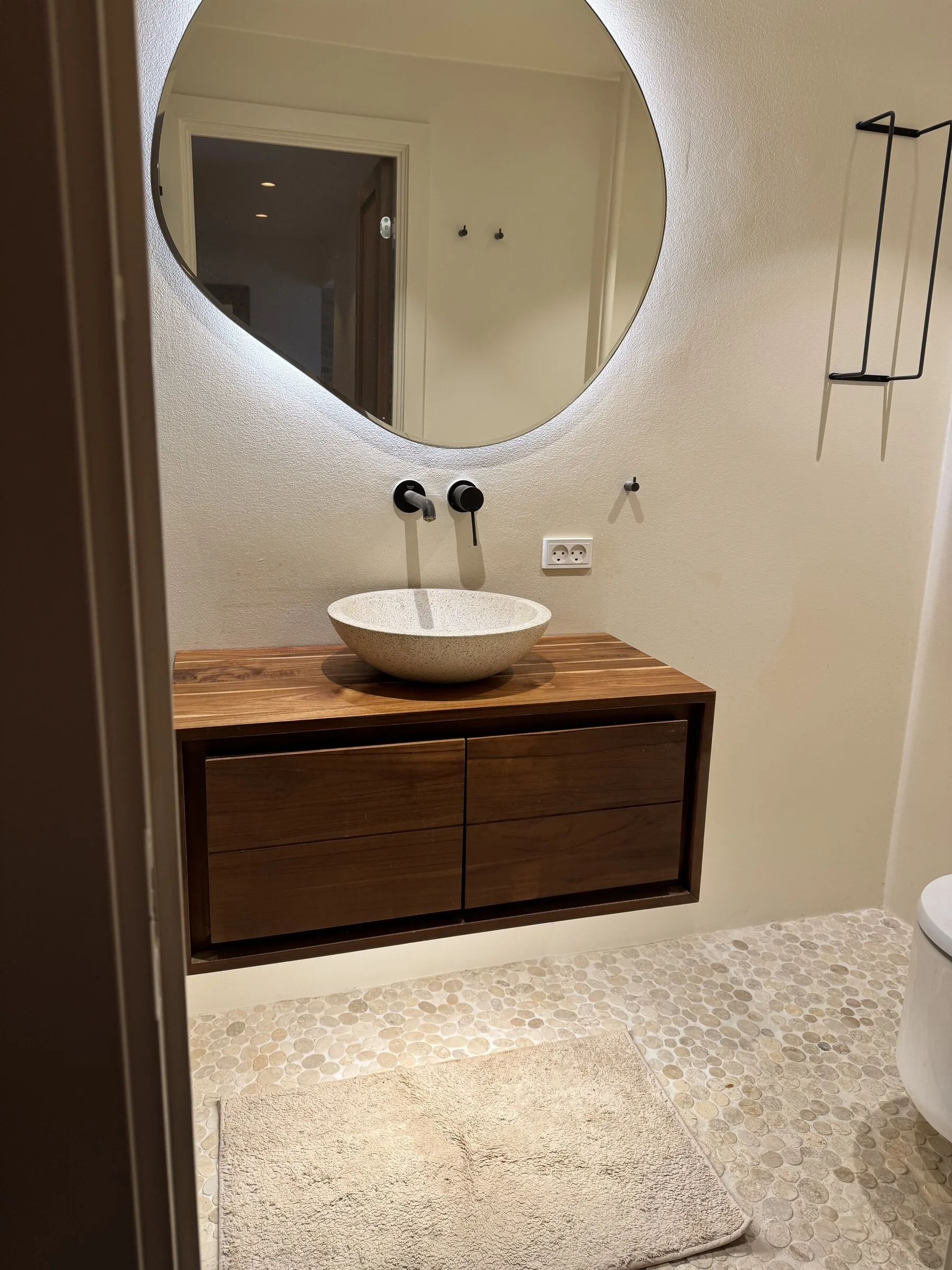 Restored bathroom vanity wood top after sanding and oil finishing