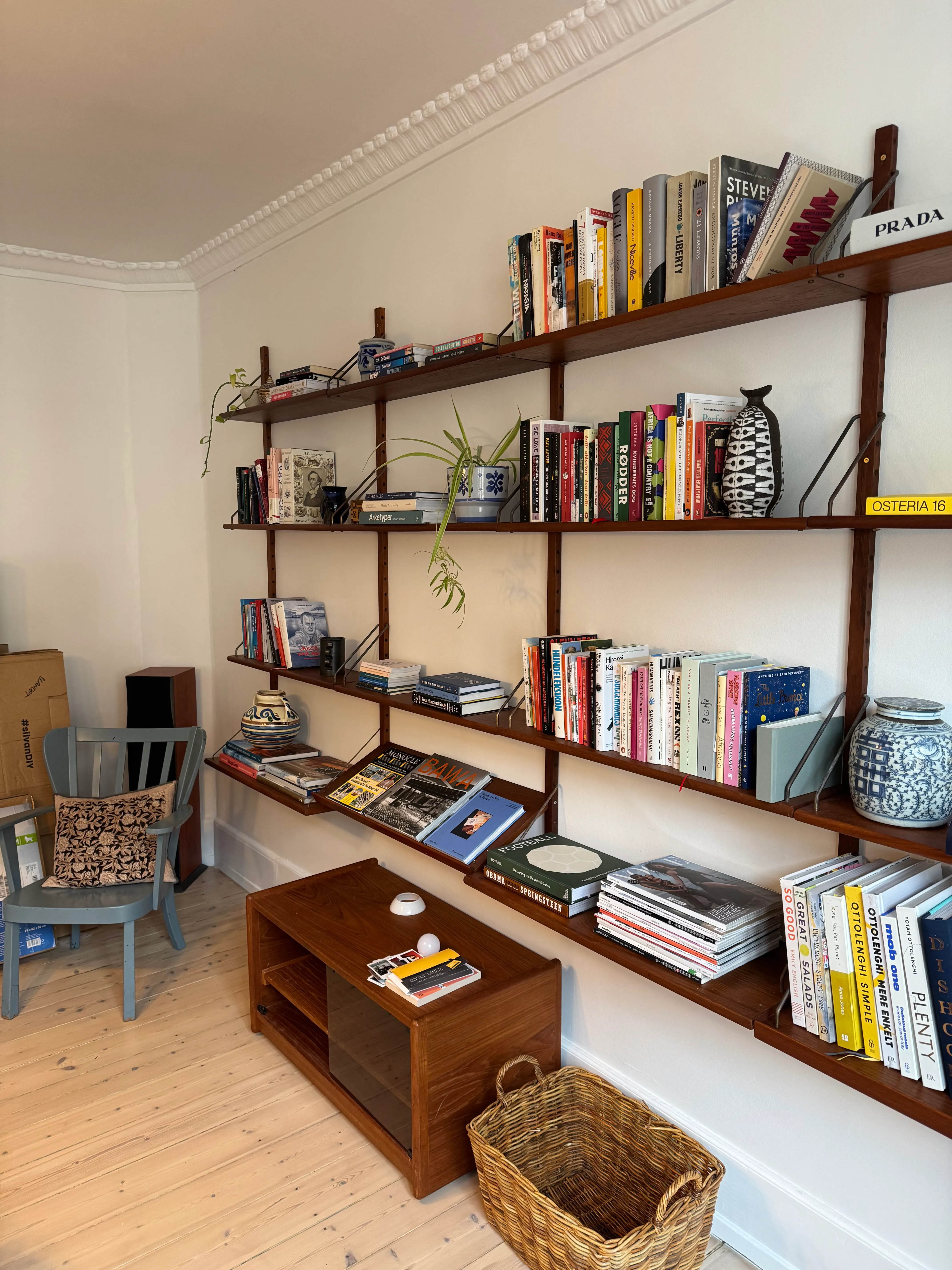 Installed Cadovius Royal wall shelving system furnished with books and objects in a Frederiksberg apartment