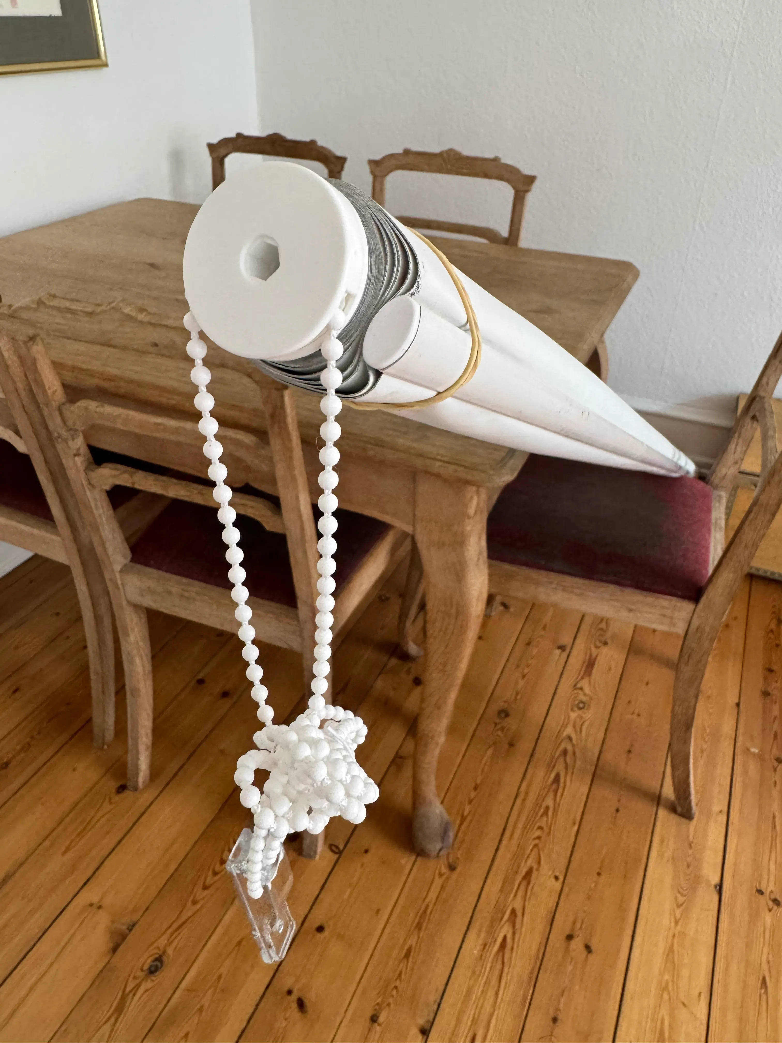 Repaired roller blind with replacement chain mechanism fitted to the original tube
