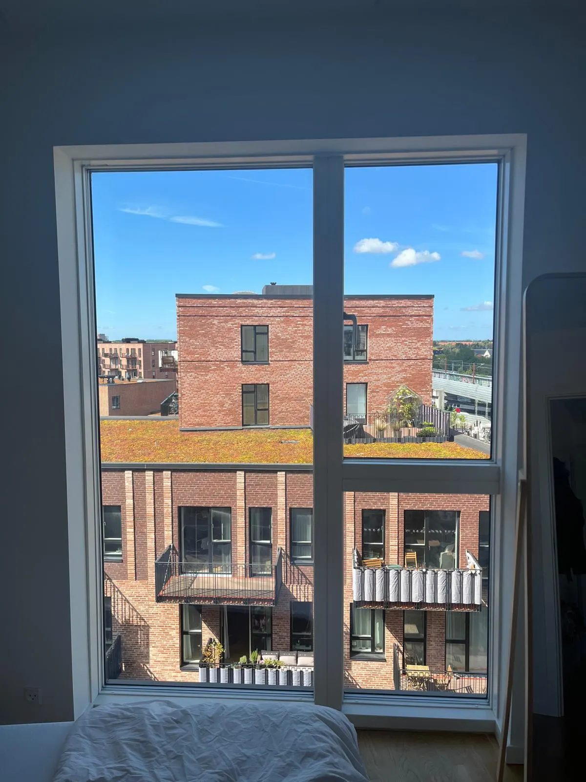 Tall window recess before roller blind installation in a Valby apartment