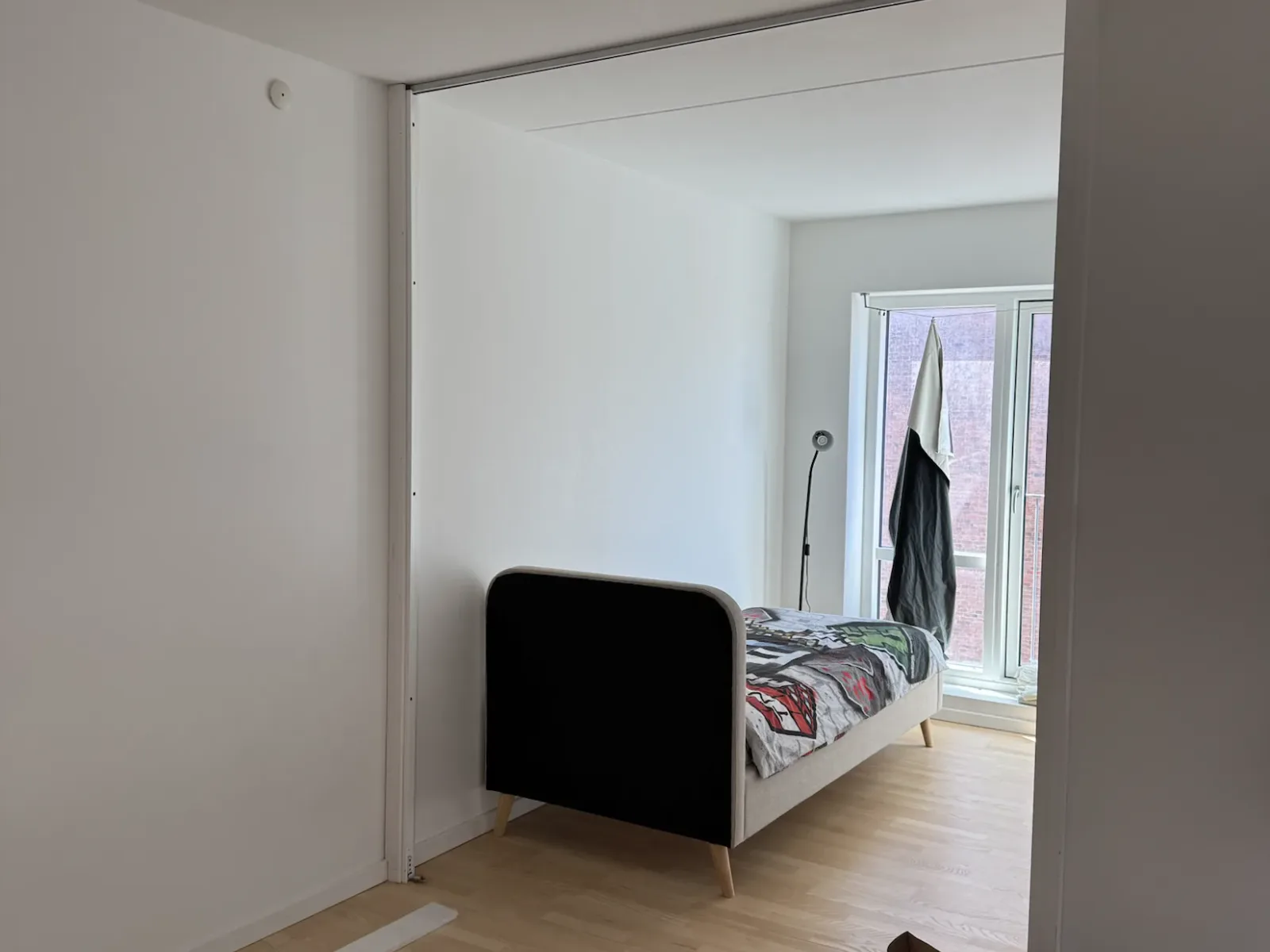 Open room area before installing a sliding door system in a Copenhagen apartment