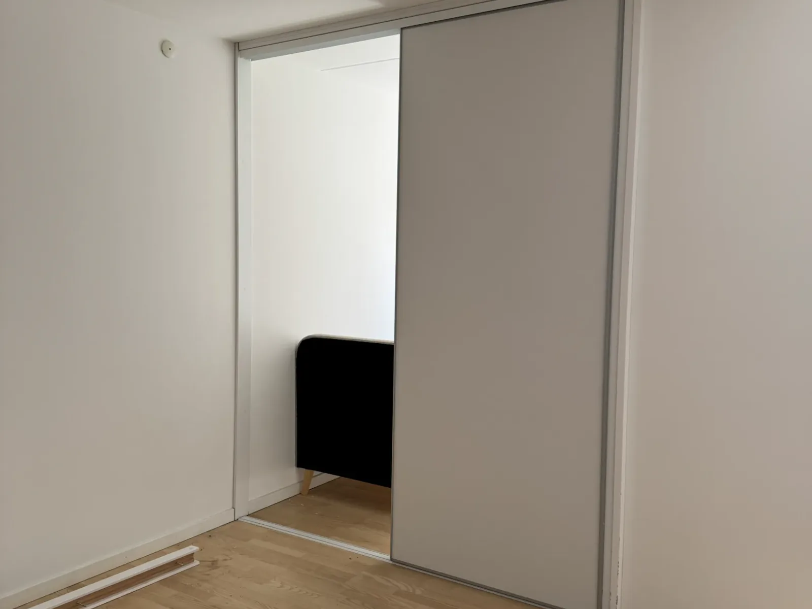 Finished sliding door installation creating a room divider in a Copenhagen apartment